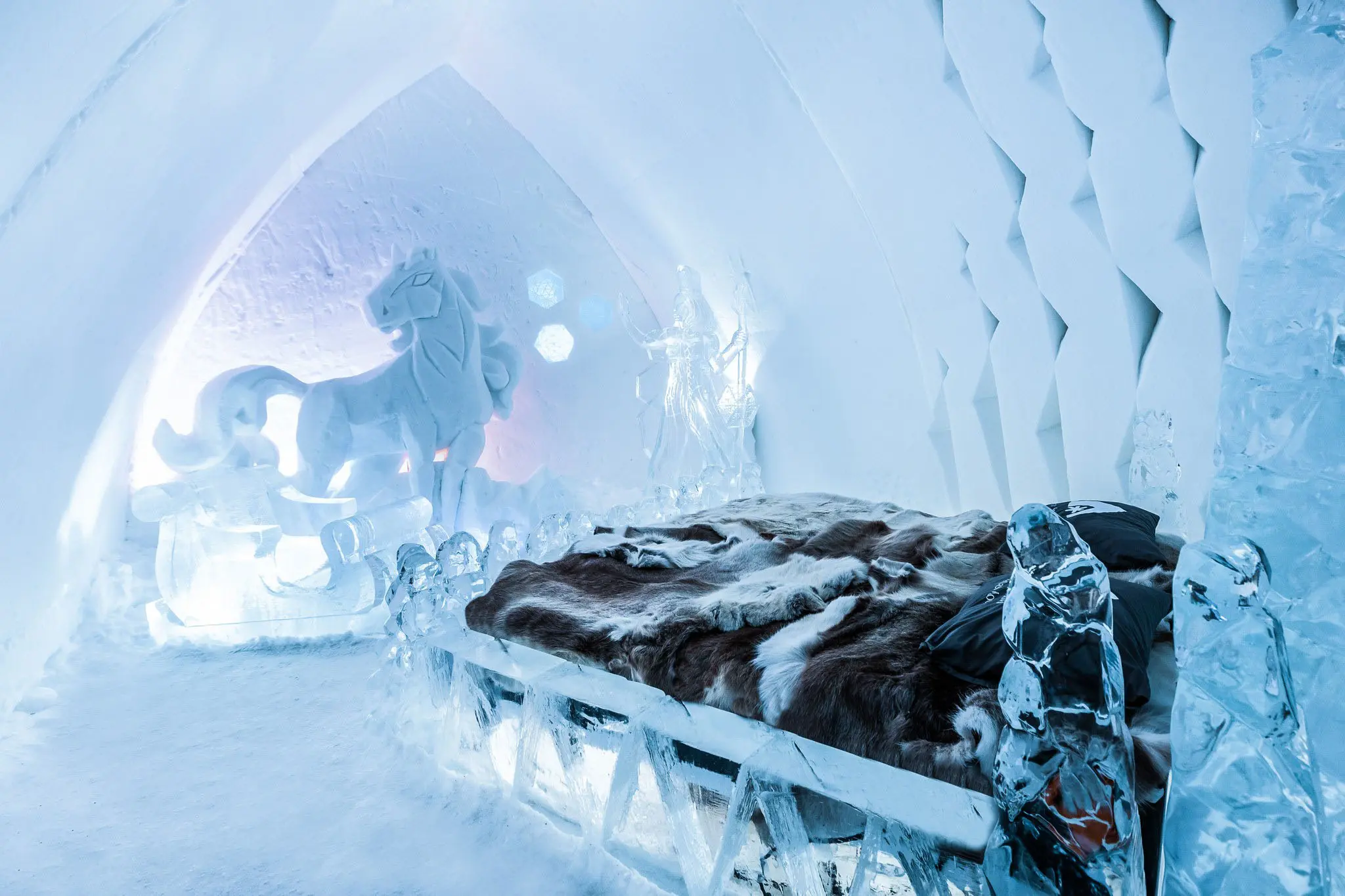 Snow walls and glass igloos side by side outside Rovaniemi.