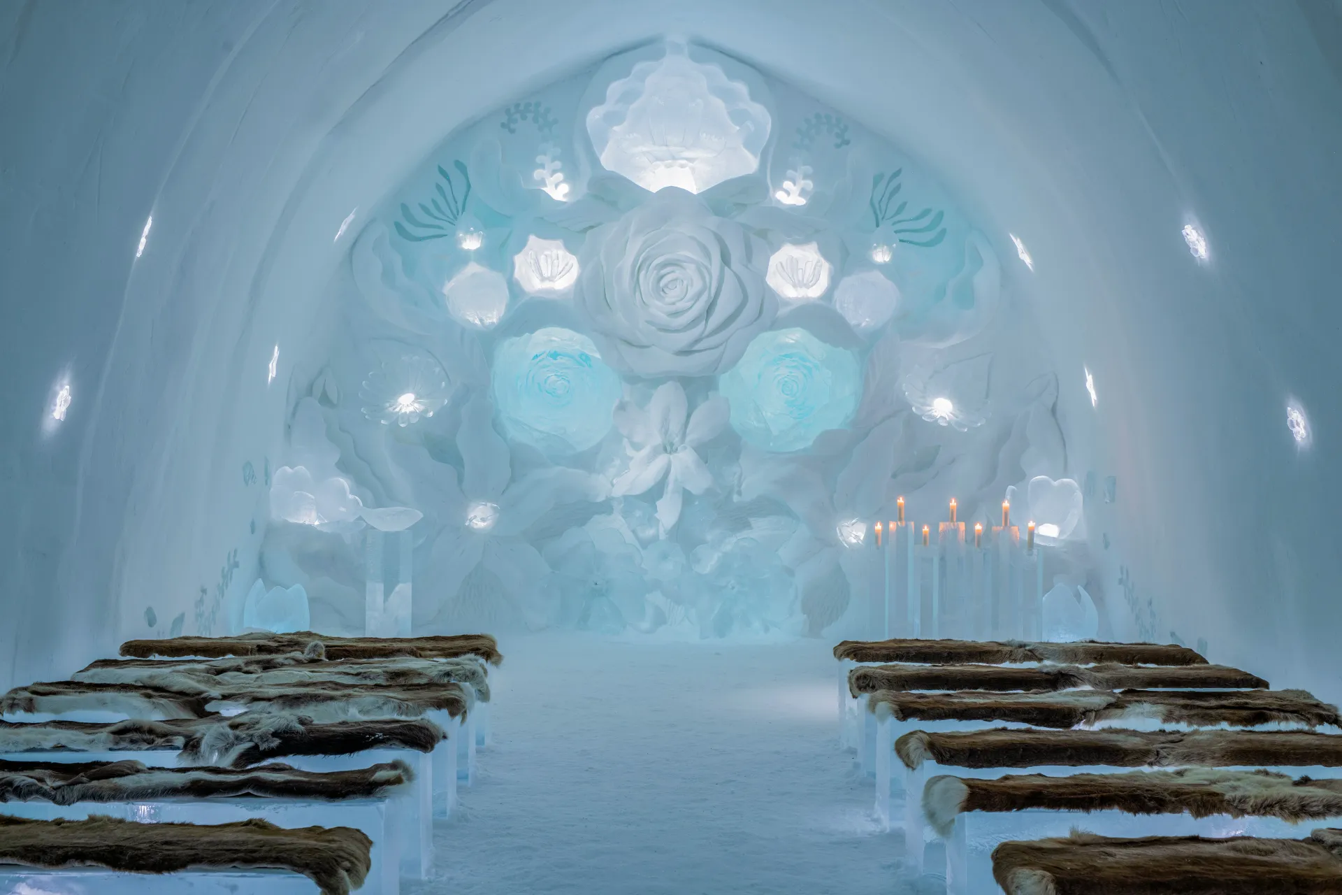 A hall of packed snow and cut ice inside a winter building.